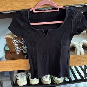 Black T-Shirt with a cute V-neckline.